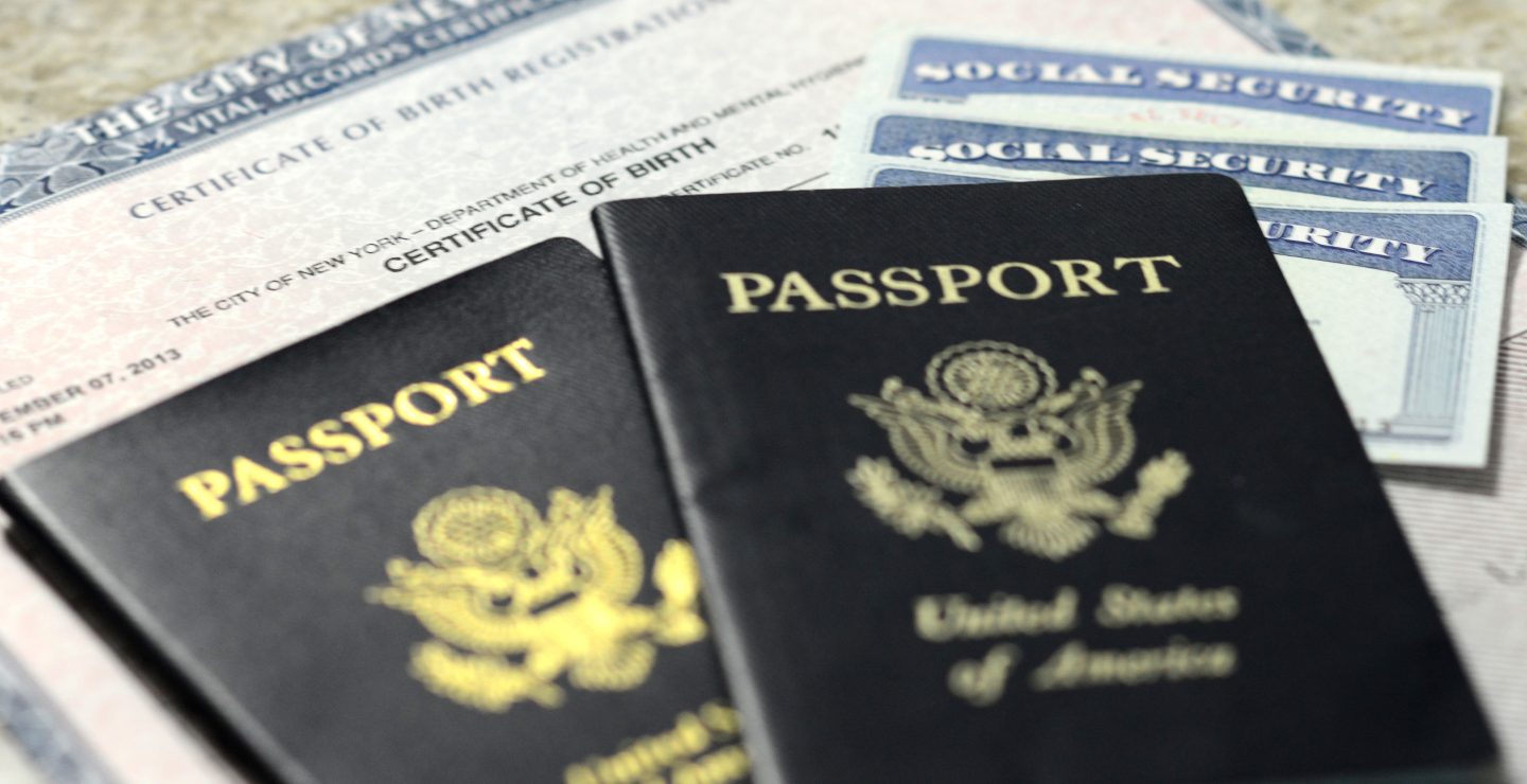 Image of two U.S.A. passports on top of a birth certificate and Social Security cards.